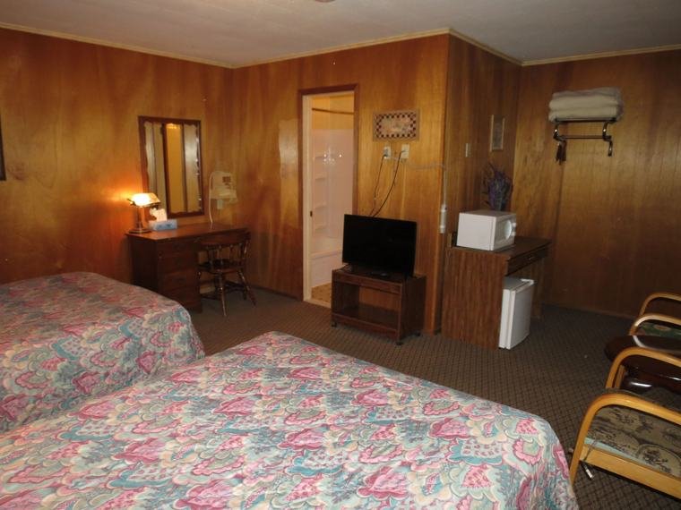 Standard room with a TV, desk and mini fridge
