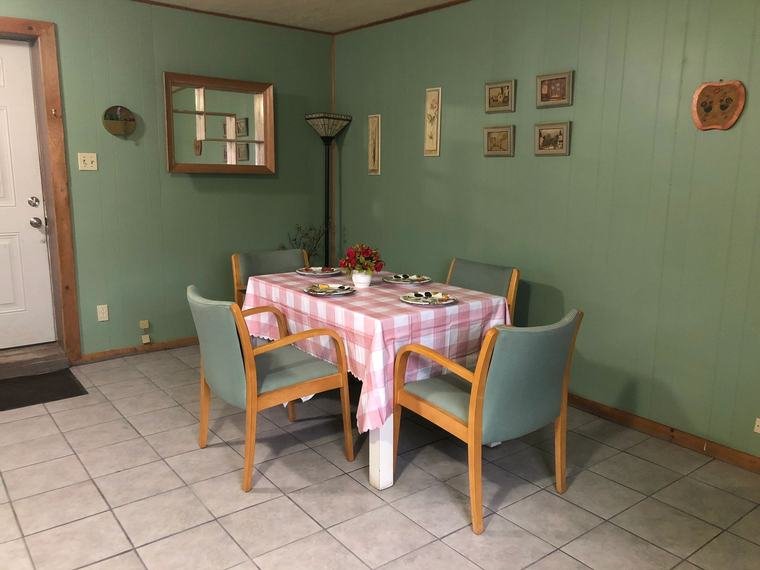 Suite dining area with table and chairs